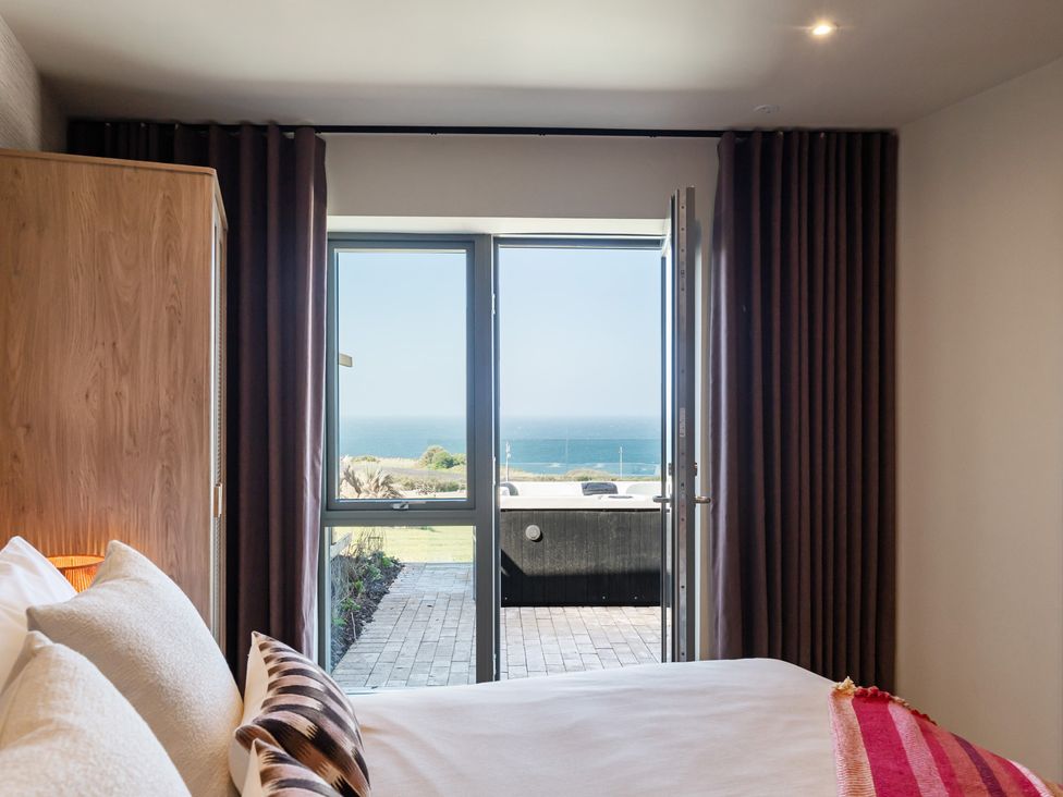 A bedroom with a view of the sea at tbc in St. Ives
