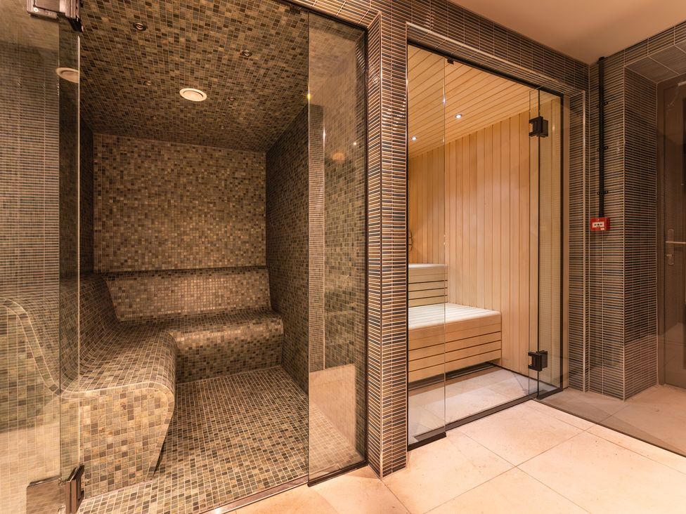 A steam room and sauna area at Hidden 17- Lookout Terrace Hot Tub in St Ives