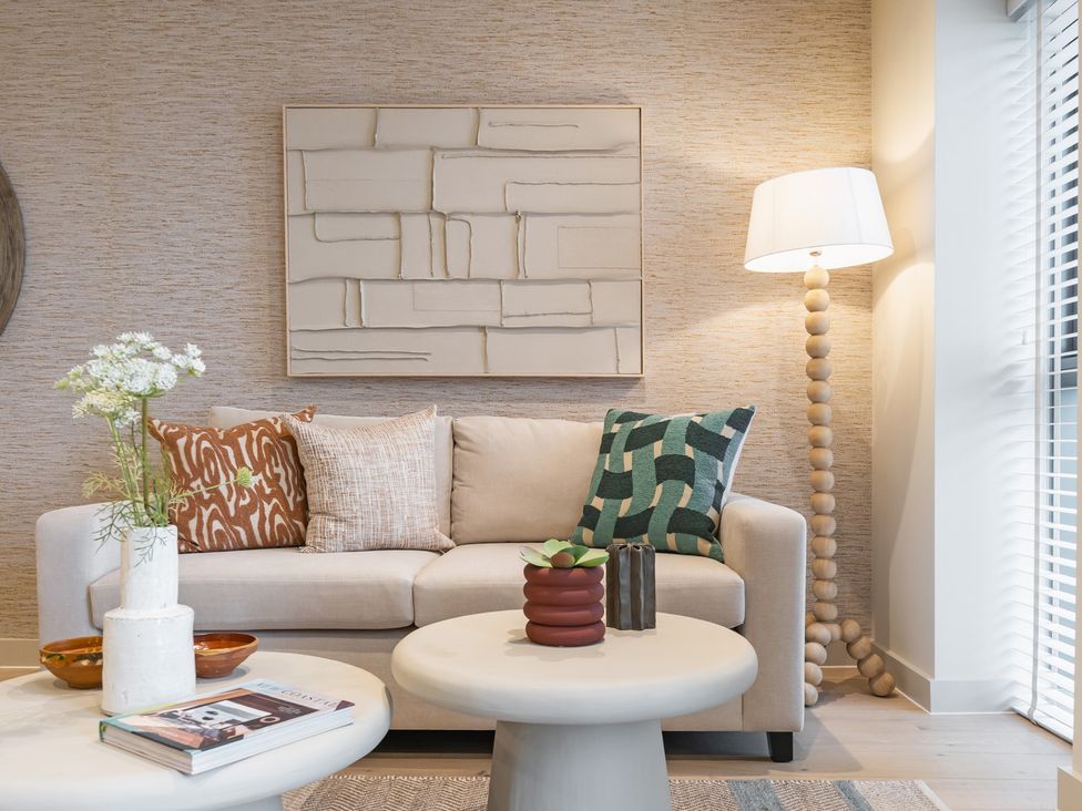 A living room with a sofa and coffee table at Hidden 19- Coastal Hot Tub in St Ives