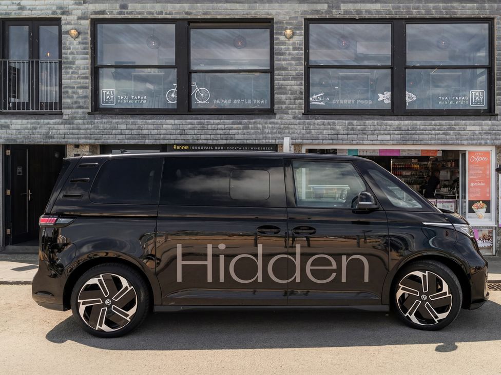 A black vehicle parked in front of a building at Hidden 20- Gallery Hot Tub in St Ives