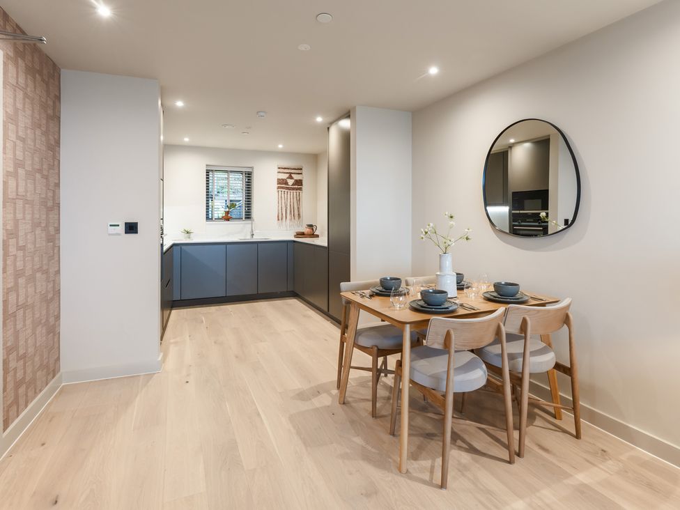 A dining room with a table and chairs at tbc in St. Ives