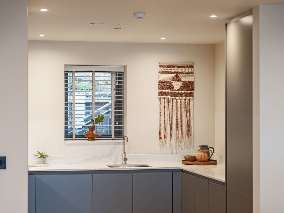 A kitchen with a sink and window at tbc in St. Ives