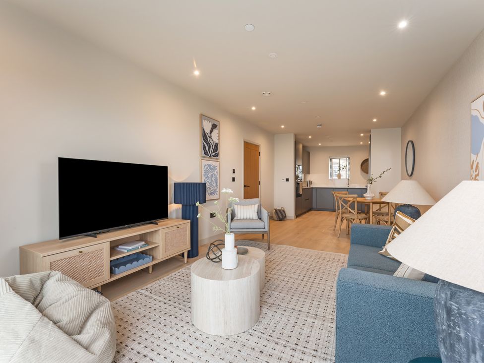 A living room with a television and sofa at tbc in St. Ives