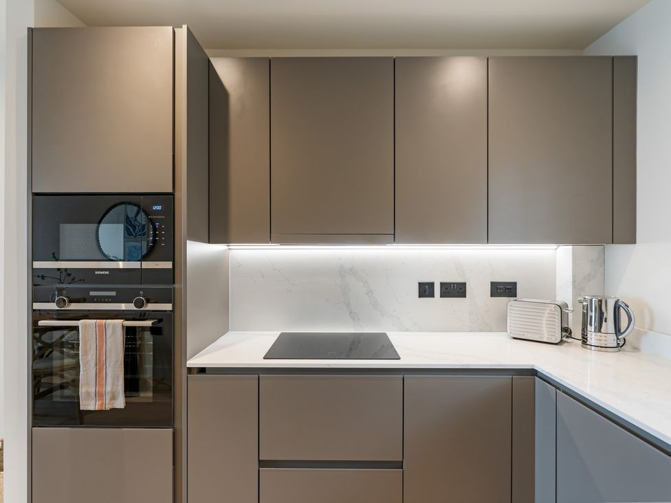 A kitchen with built-in oven and cooktop at tbc in St. Ives