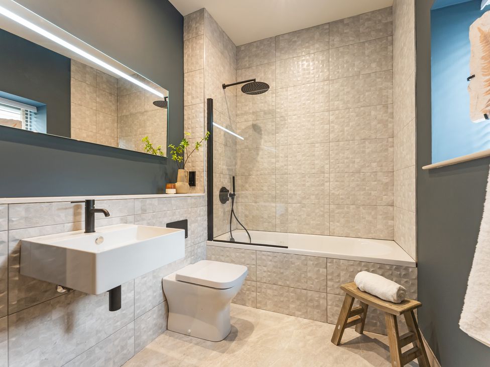 A bathroom with a sink toilet and bathtub at tbc in St. Ives