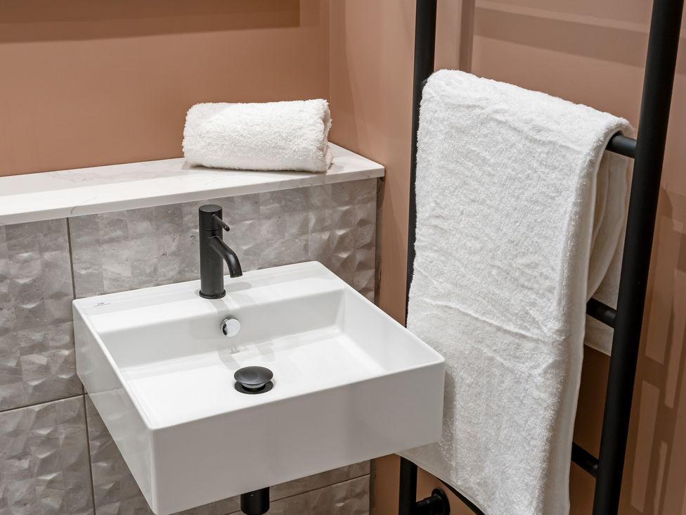 A sink and towels in a bathroom at tbc in St. Ives
