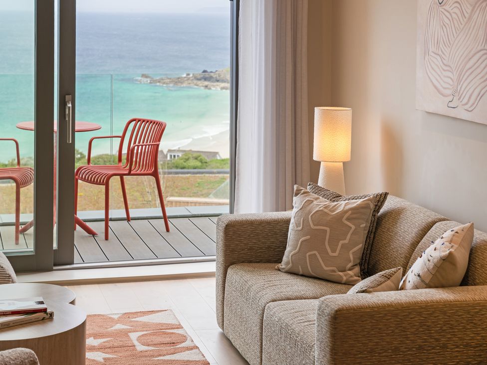 A living room with a view of the sea at Hidden 10- Godrevy View in St Ives