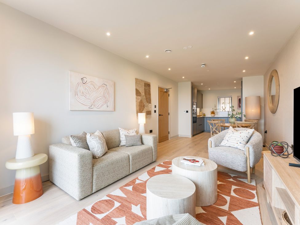 A living room with a sofa and coffee table at Hidden 10- Godrevy View St Ives