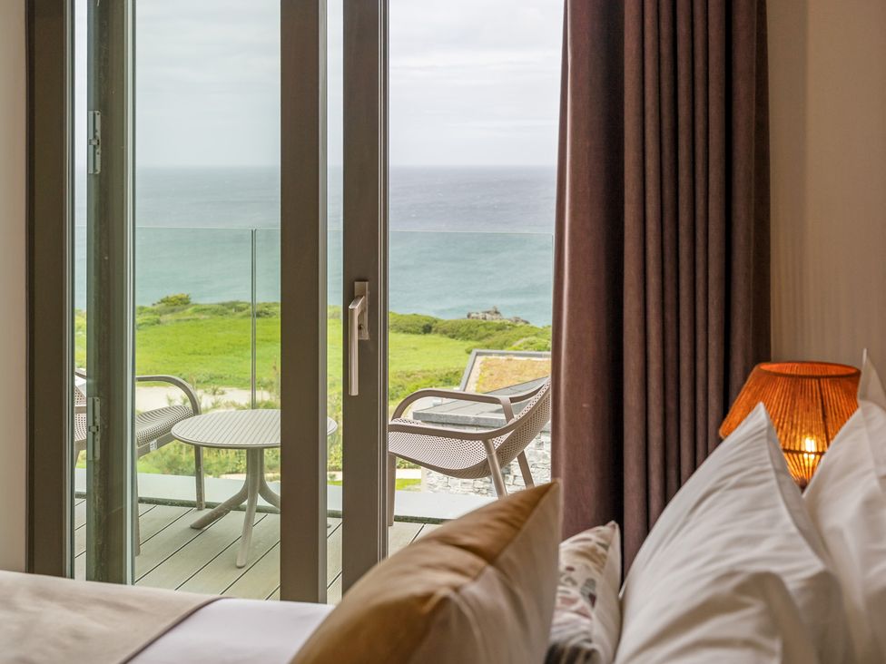 A bedroom with a view of the ocean at Hidden 10- Godrevy View in St Ives
