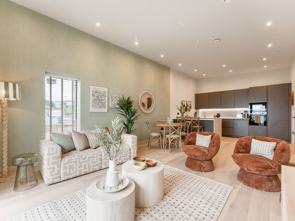 A living room with kitchen area at tbc in St. Ives