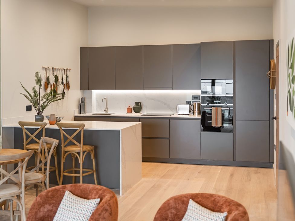 A kitchen with cabinets and appliances at tbc in St. Ives