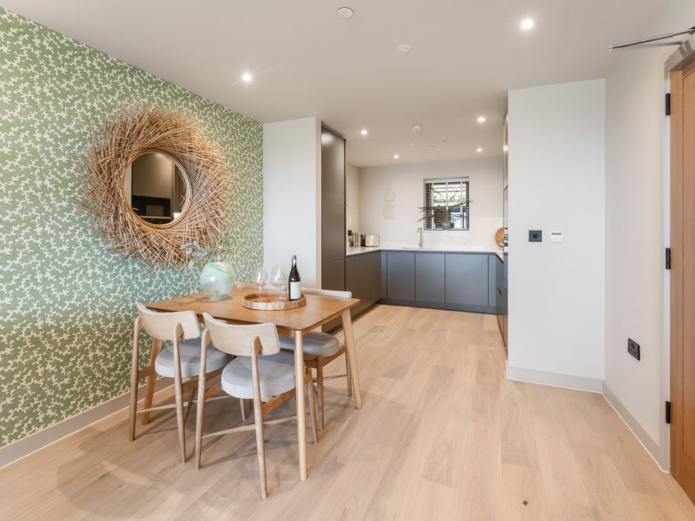 A dining room with a table and chairs at tbc in St. Ives