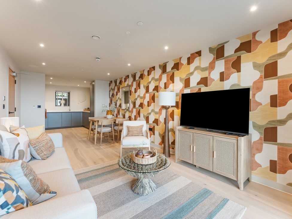 A living room with a sofa and tv at tbc St. Ives