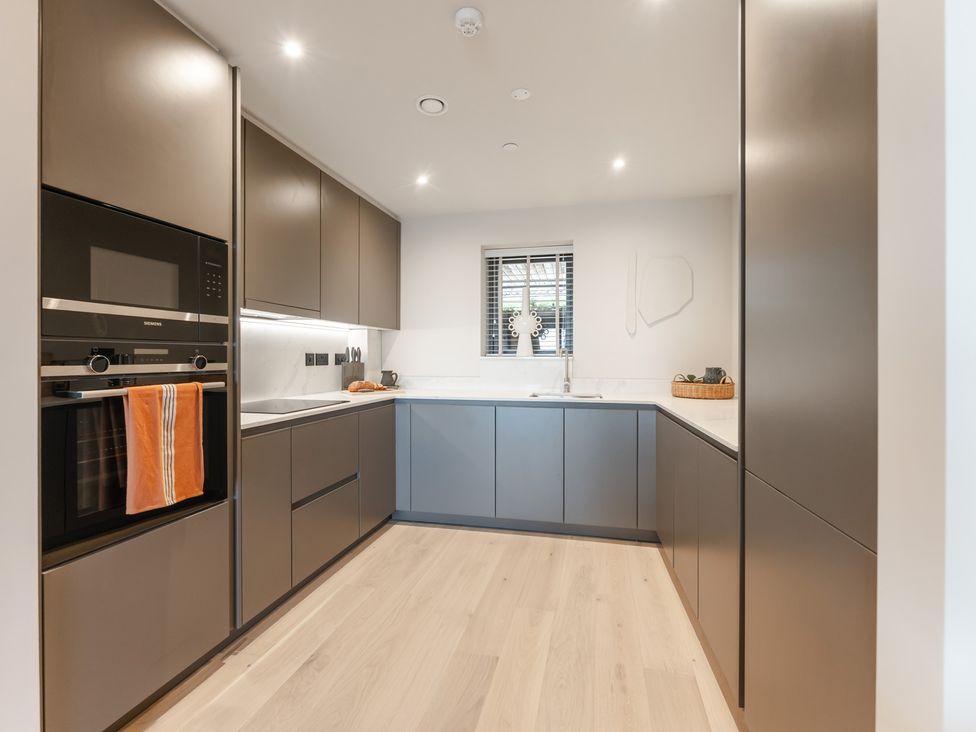A kitchen with a sink and oven at tbc in St. Ives