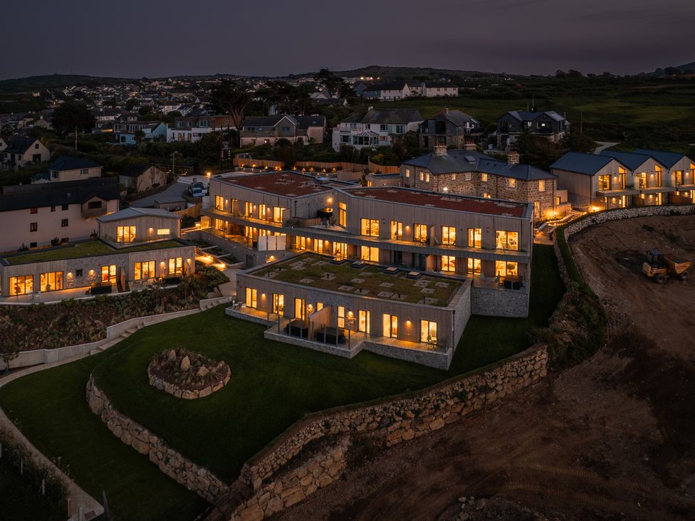 A view of buildings with illuminated windows at Hidden 14- Garden Terrace St Ives