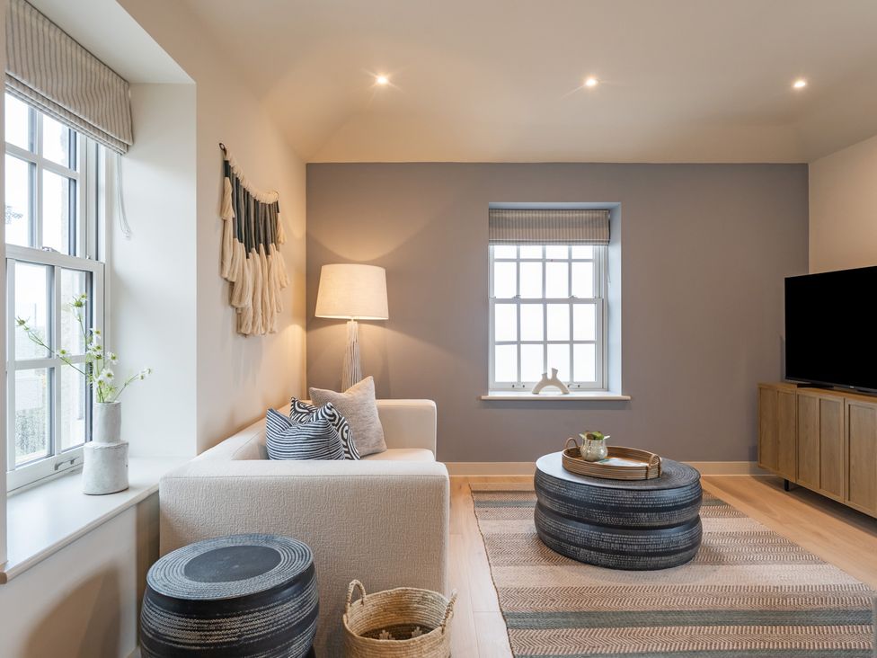 A living room with a couch and television at tbc in St. Ives