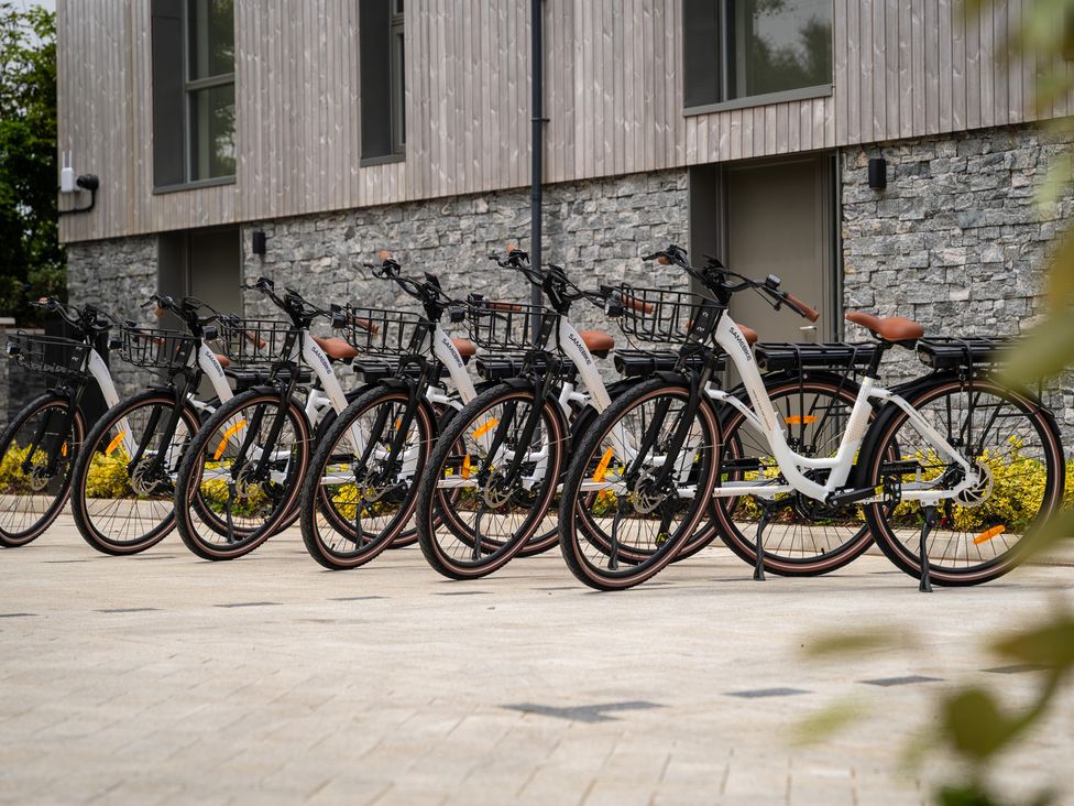A row of bicycles parked outside a building at Hidden 4- Elvan Duplex Hot Tub St Ives