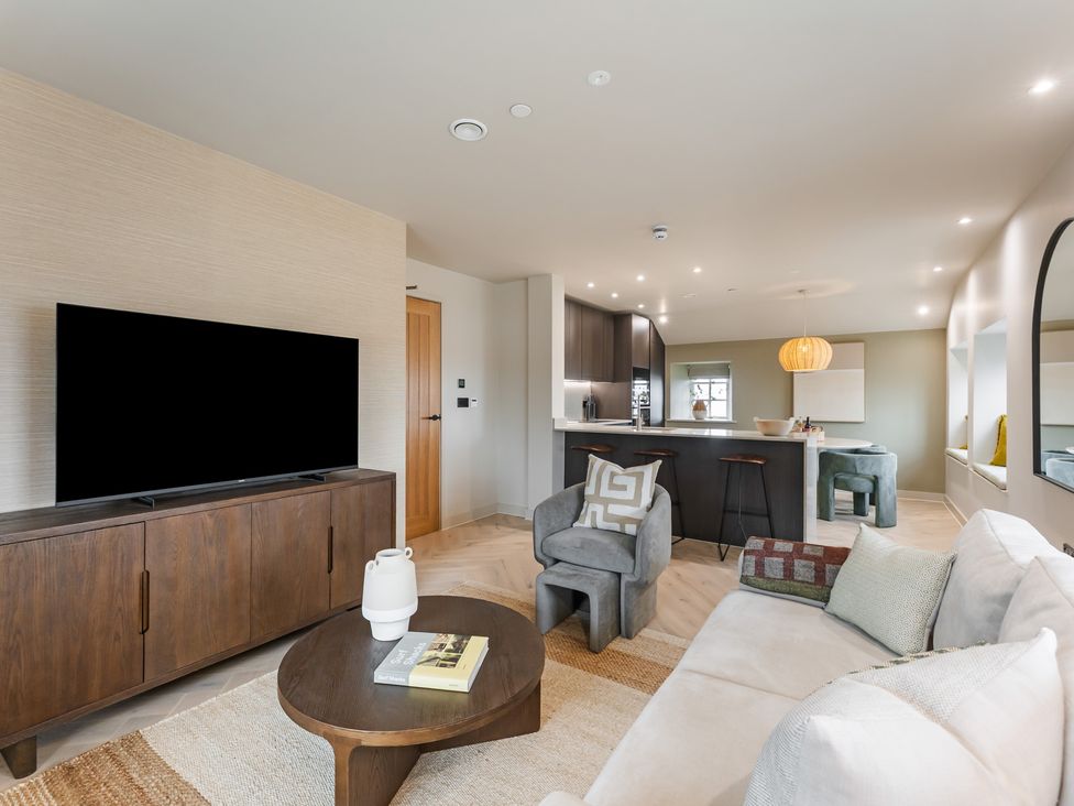 A living room with a television and sofa at tbc St. Ives