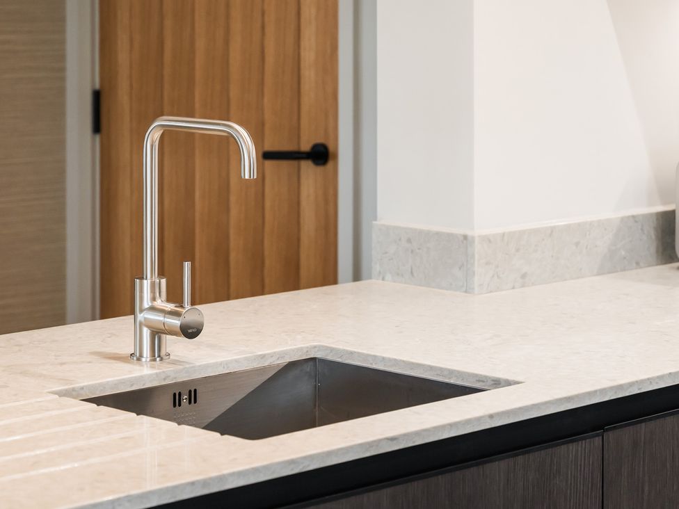 A kitchen with a sink and faucet at tbc in St. Ives