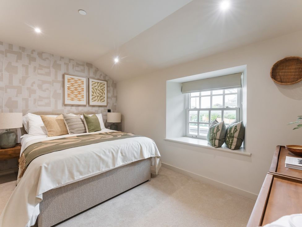 A bedroom with a bed and window at tbc St. Ives