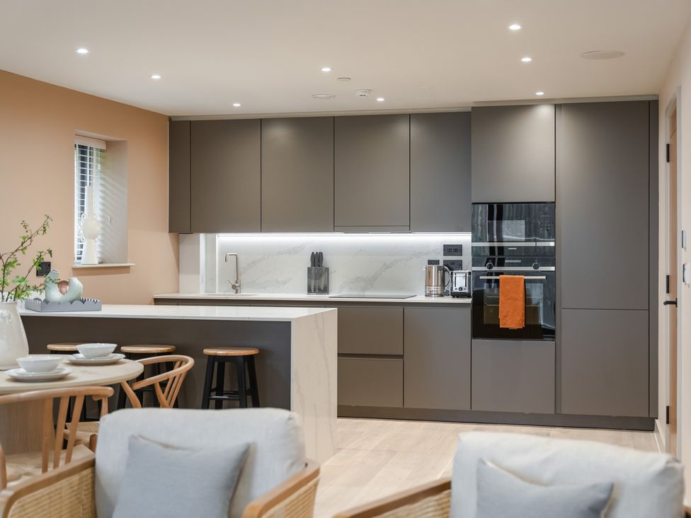 A kitchen with cabinets, sink and countertop at tbc in St. Ives
