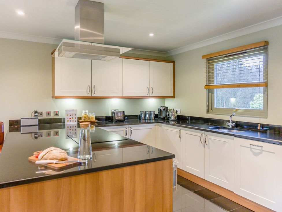 A kitchen with cabinets and countertop at The Derwent Spa (Pet) Slaley