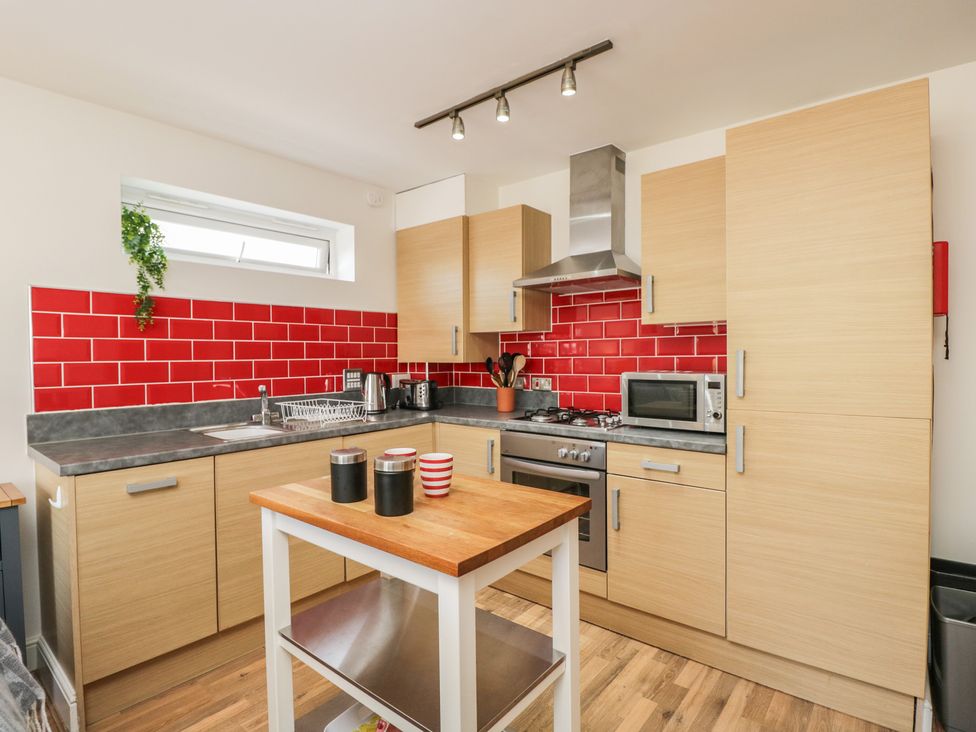A kitchen with sink and appliances at 7 Blue Water in Bournemouth