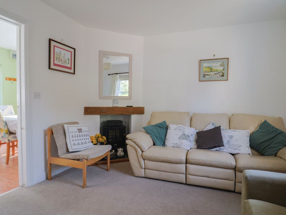 A living room with a sofa and an armchair at Morpeth in Combe St Nicholas