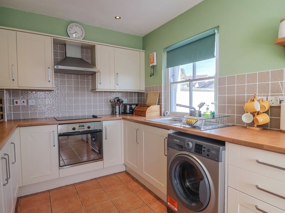 A kitchen with cabinets and appliances at Morpeth in Combe St Nicholas