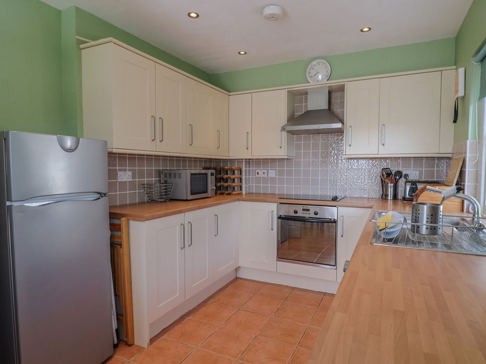 A kitchen with appliances and countertops at Morpeth in Combe St Nicholas
