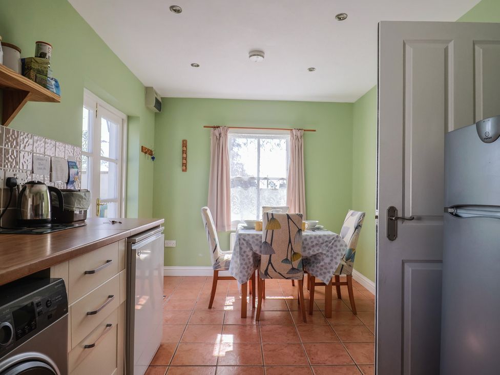 A kitchen with dining table and chairs at Morpeth in Combe St Nicholas