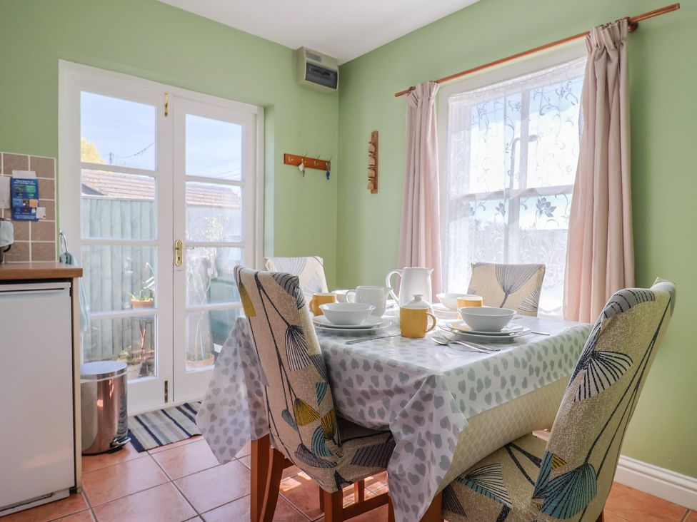 A kitchen with a dining table set for tea at Morpeth in Combe St Nicholas