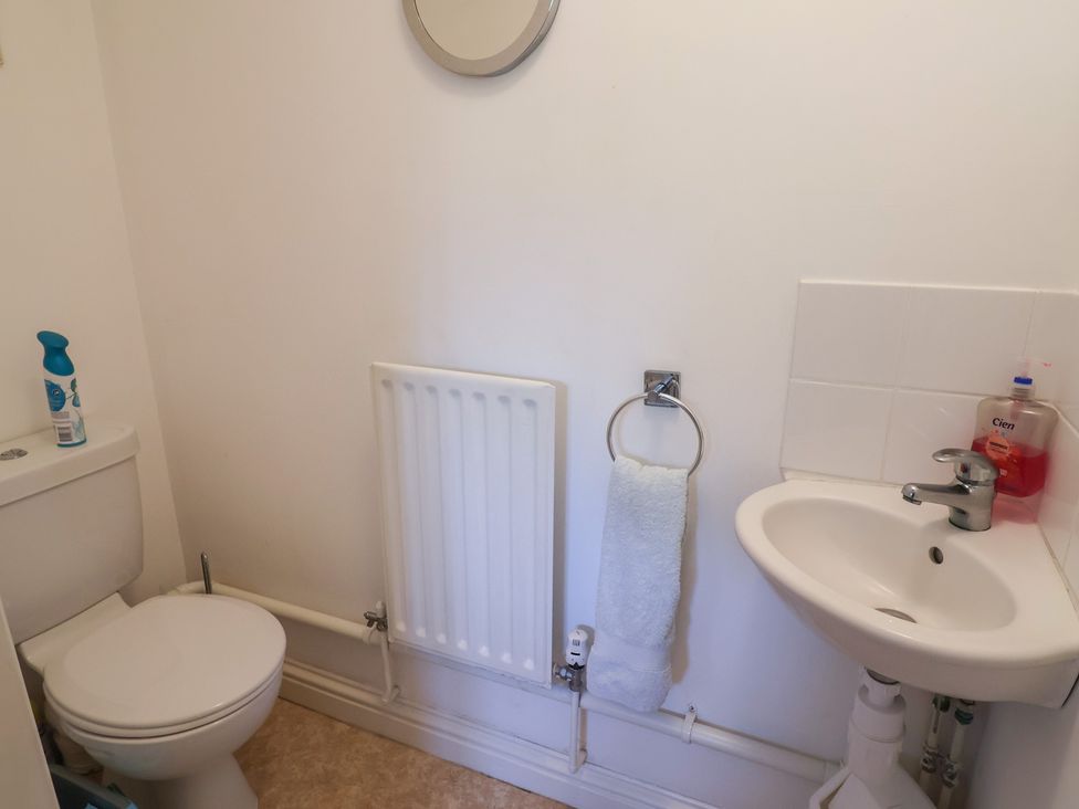 A bathroom with a toilet and sink at Morpeth in Combe St Nicholas