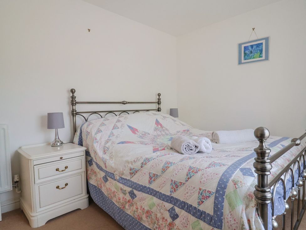 A bedroom with a bed and bedside table at Morpeth in Combe St Nicholas