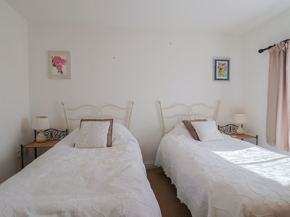 A bedroom with two beds and lamps at Morpeth in Combe St Nicholas