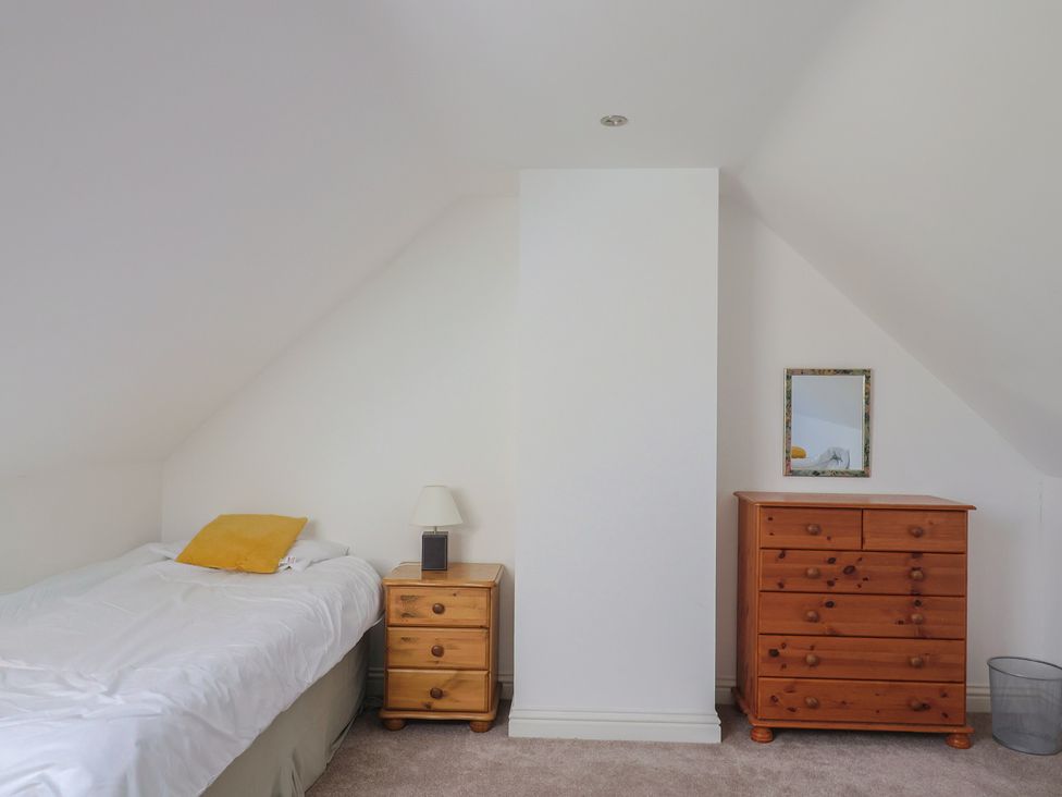 A bedroom with a bed and a dresser at Morpeth in Combe St Nicholas
