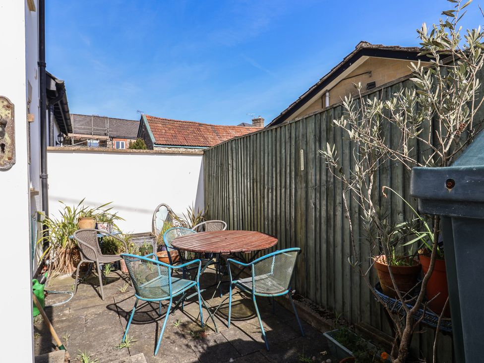 A garden with a table and chairs at Morpeth in Combe St Nicholas