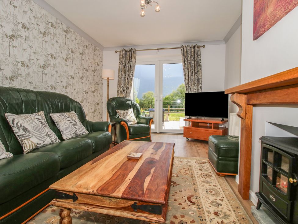 A living room with a sofa and coffee table at Onny Views in Craven Arms