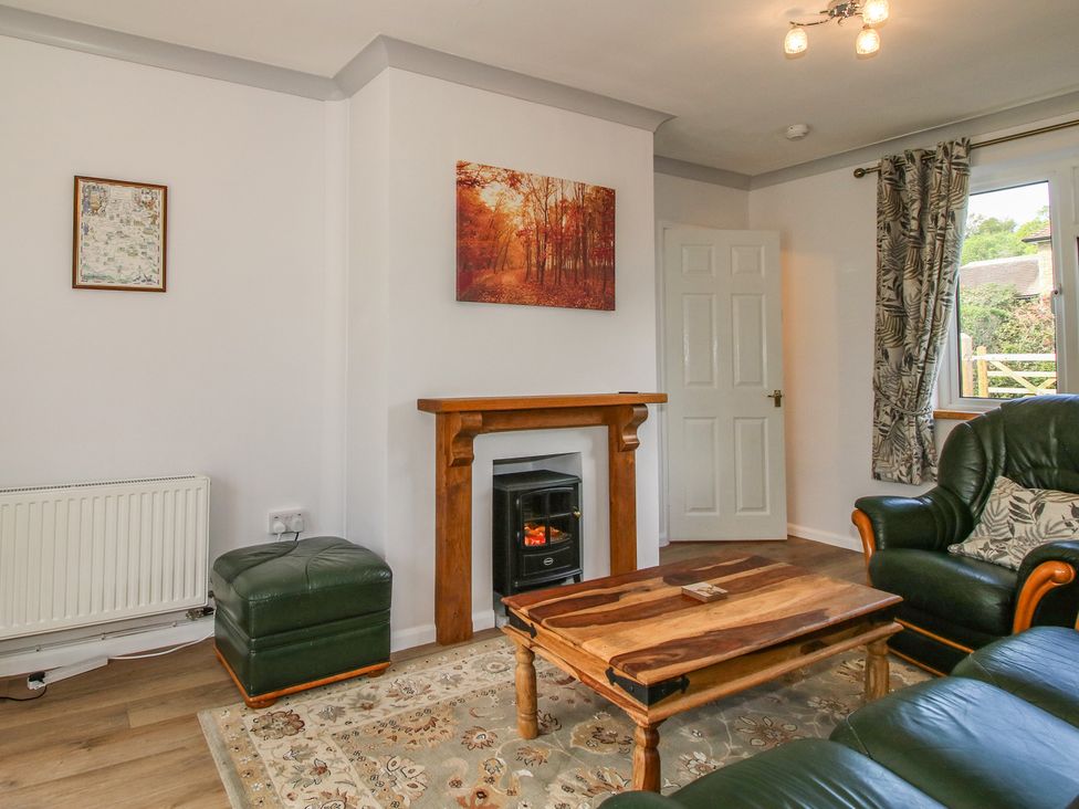 A living room with a sofa and a coffee table at Onny Views in Craven Arms