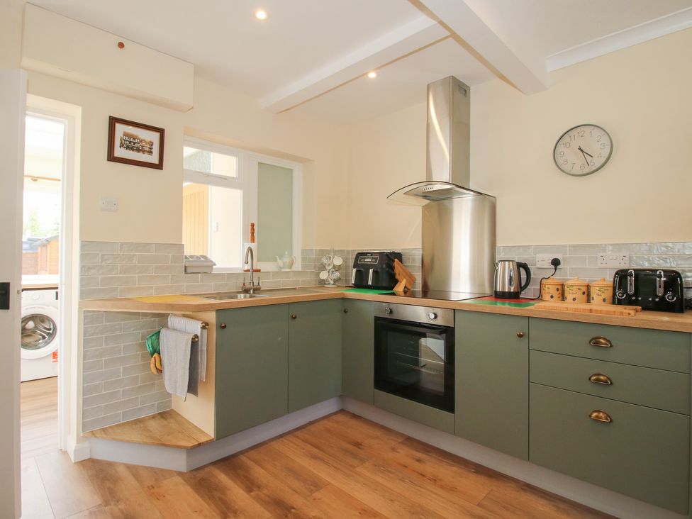 A kitchen with cabinets and appliances at Onny Views in Craven Arms