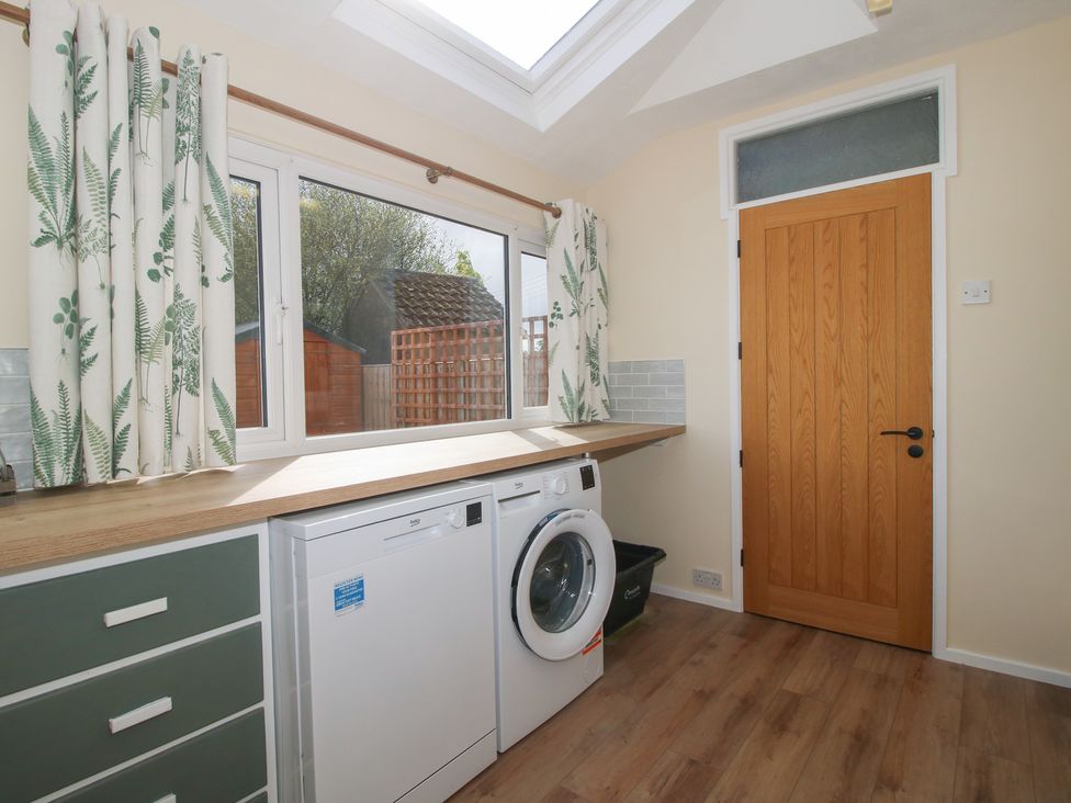 A laundry room with a washing machine and dryer at Onny Views in Craven Arms