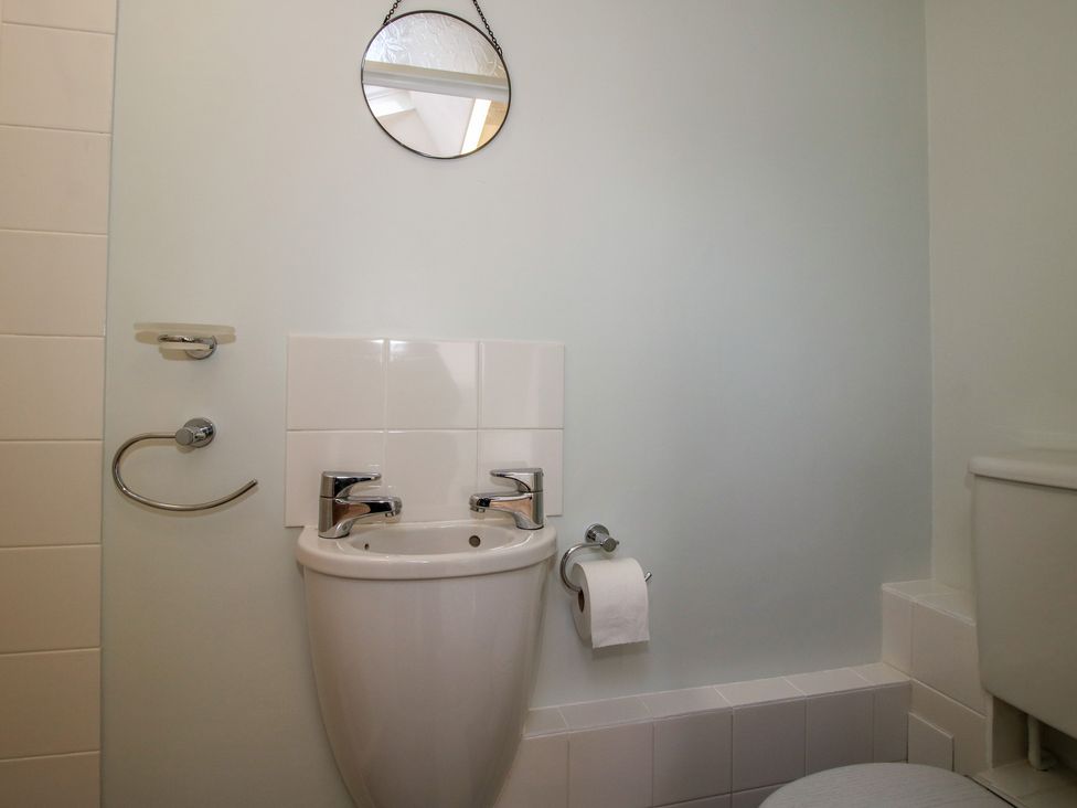 A bathroom with a sink and toilet at Onny Views in Craven Arms