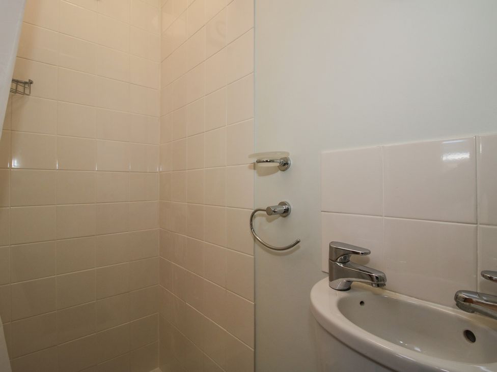A bathroom with a shower and sink at Onny Views in Craven Arms