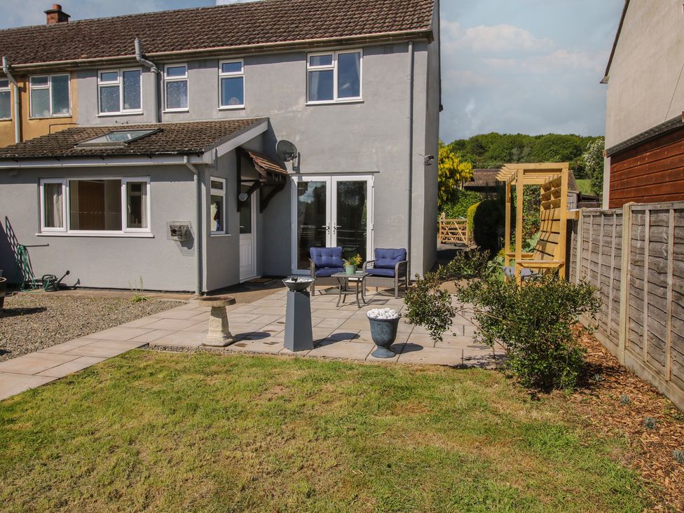 A garden with patio furniture and plants at Onny Views in Craven Arms