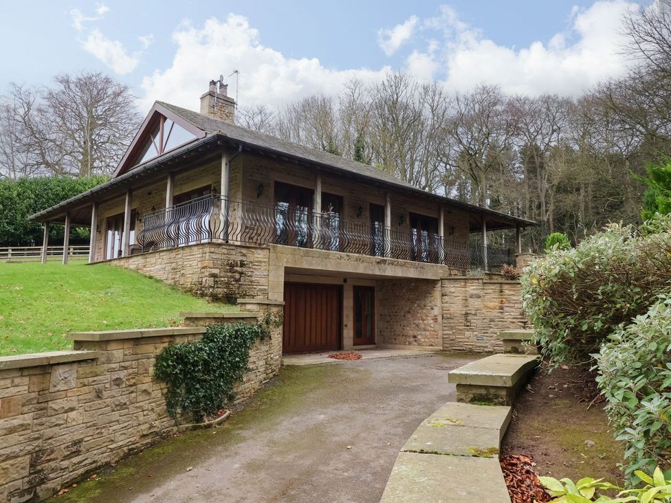 A house with a balcony and garage at Sandy Gate in Knaresborough