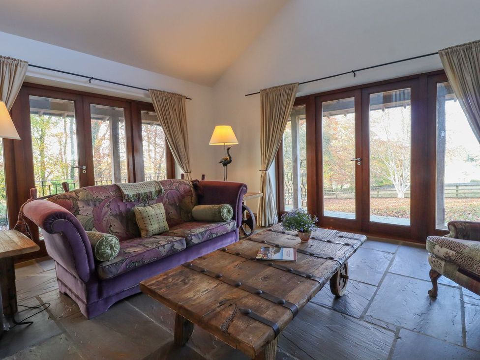 A living room with a sofa and coffee table at Sandy Gate in Knaresborough