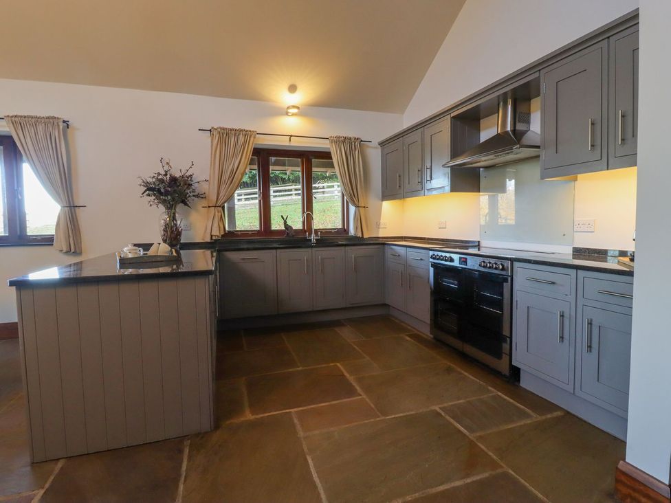 A kitchen with cabinets and an oven at Sandy Gate in Knaresborough