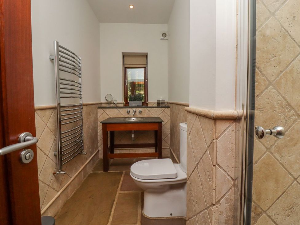 A bathroom with a sink and toilet at Sandy Gate in Knaresborough