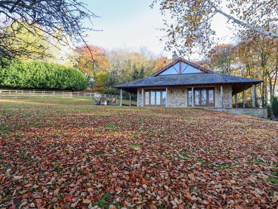 An outdoor view of a house with leaves on the ground at Sandy Gate in Knaresborough