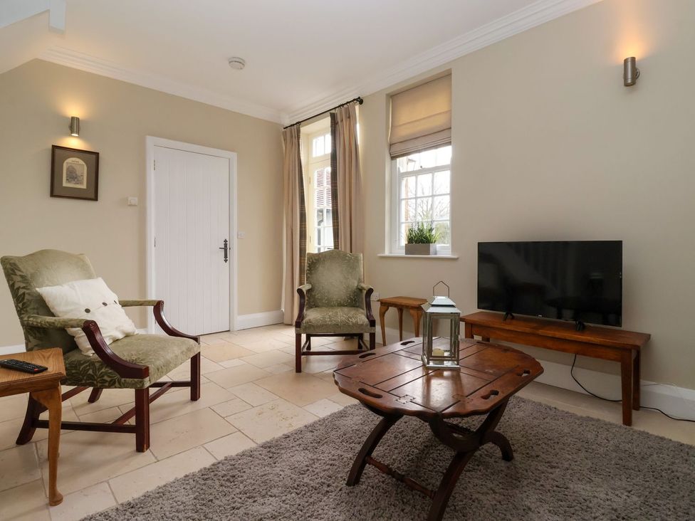 A living room with chairs and a table at The Bothy in Knaresborough